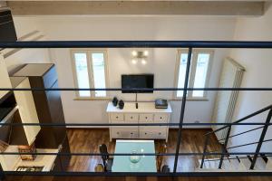 a view of a room with a desk and a tv at Loft del Faro in Fano