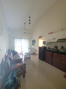 a large room with a kitchen and a living room at paradise villa in Varca