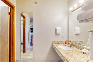 a bathroom with a sink and a mirror at Chula Vista Condo Villa 7213 in Wisconsin Dells