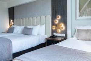 En eller flere senger på et rom på Hotel HW High Wellness