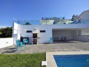 a villa with a swimming pool and a house at Charming Caminha Villa - 4 Bedrooms - Villa Caminha View - Private Pool and Astounding Sea Views - Viana do Castelo in Caminha