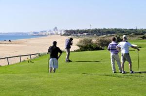 a group of people playing golf on the beach at Charming Caminha Villa - 4 Bedrooms - Villa Caminha View - Private Pool and Astounding Sea Views - Viana do Castelo in Caminha