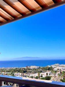 a view of the ocean from a balcony at FANTASTIC PARADISE with WiFi in Adeje