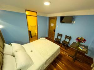 Letto o letti in una camera di Pisonay Hotel