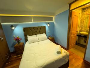 Letto o letti in una camera di Pisonay Hotel