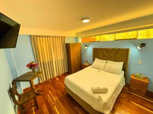 Letto o letti in una camera di Pisonay Hotel