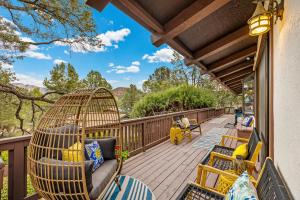a porch with chairs and a swing at Large Spanish Villa -Hot tub- Pool -Gym- Game Room in Sedona