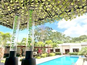 a view of the pool at the resort at Hotel Palmar Del Río in Pedernales