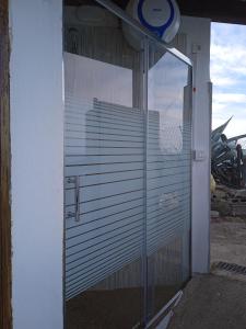 a glass door of a building with a window at Casa lucas in Almáciga