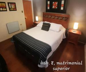 Postel nebo postele na pokoji v ubytování Hostal del Aguila