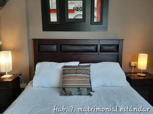 Postel nebo postele na pokoji v ubytování Hostal del Aguila