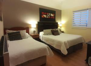 Postel nebo postele na pokoji v ubytování Hostal del Aguila