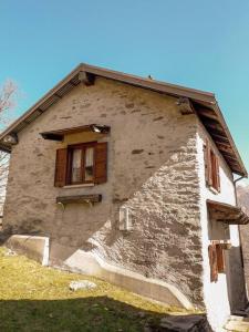 a building with a window on the side of it at Chalet Alpe Quaggiui in Calasca Castiglione