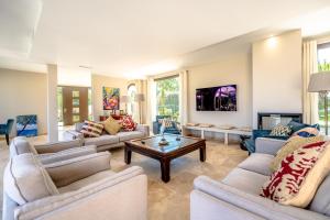 a large living room with couches and a coffee table at Villa Grimaud in Grimaud