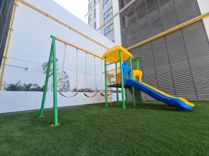 a playground in a building with a slide at Depa y Alberca a 5 min del auditorio in Guadalajara
