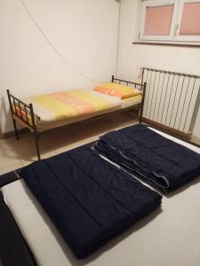 a bedroom with a bunk bed with blue sheets at Apartman SM IK in Tomislavgrad