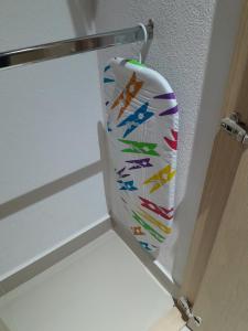 a white door with a colorful curtain hanging on it at Reserva del Mar Resort Club de Playa in Santa Marta
