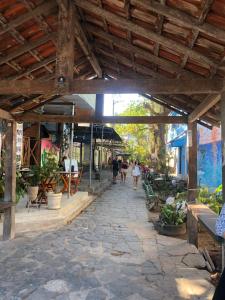 a group of people walking down a stone walkway at Apartment Ilha da Gigóia in Rio de Janeiro