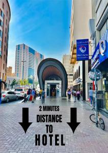 a sign that reads minutes distance to a hotel at Mark Inn Hotel Deira in Dubai