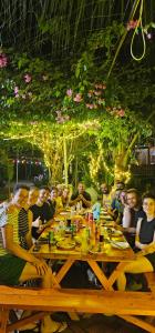 a group of people sitting at a long table at Fairy Mountain Retreat in Ninh Binh