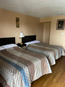 Cama o camas de una habitación en Victoria Motel