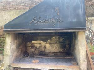 a fireplace with a sign on top of it at Casa a una cuadra de costanera Gualeguaychu Hasta 8 personas in Gualeguaychú +3 photos