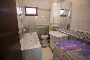 Ванна кімната в Apartments Villa Ban