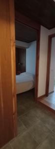 a room with a bedroom with a bed in it at Departamento Campanita in San Martín de los Andes