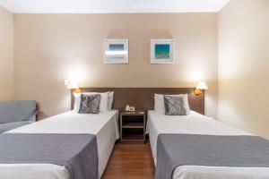 Postel nebo postele na pokoji v ubytování Gran Villagio Hotel SP by Castelo Itaipava
