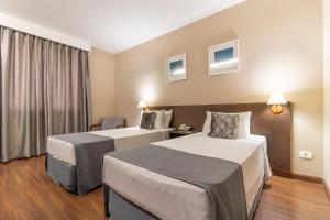 Postel nebo postele na pokoji v ubytování Gran Villagio Hotel SP by Castelo Itaipava
