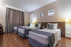 Postel nebo postele na pokoji v ubytování Gran Villagio Hotel SP by Castelo Itaipava