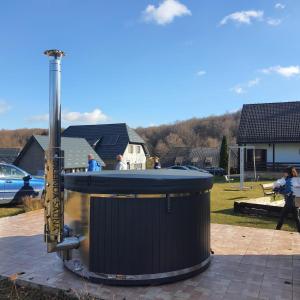 aendiaryendiary device in a yard with people walking at Pansion Danica in Rastovača