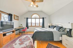 a bedroom with a bed and a flat screen tv at Cozy Levittown Apartment Full Kitchen and Smart TV! 