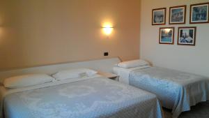 Postel nebo postele na pokoji v ubytování Hotel Le Vigne di Corvino