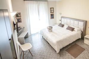Postel nebo postele na pokoji v ubytování Hotel Le Vigne di Corvino