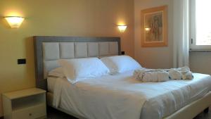 Postel nebo postele na pokoji v ubytování Hotel Le Vigne di Corvino