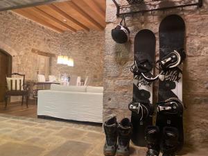 a group of snowboards are hanging on a wall at Arachova5634 in Arachova