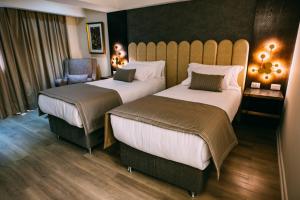 En eller flere senger på et rom på Hotel HW High Wellness