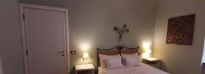 Postel nebo postele na pokoji v ubytování B&B A Casa Tua
