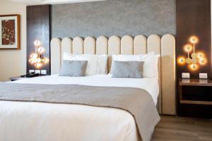 En eller flere senger på et rom på Hotel HW High Wellness