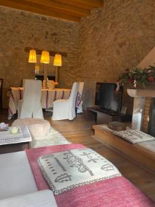 a living room with a couch and a tv at Arachova5634 in Arachova