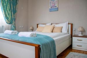 Postel nebo postele na pokoji v ubytování Infinity Boutique Apartments