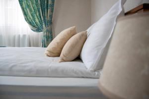 Postel nebo postele na pokoji v ubytování Infinity Boutique Apartments