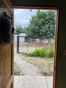 an open door with a view of a yard at Casa Mía Blue 2 in Chillán