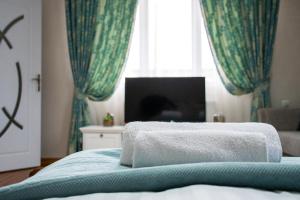 Postel nebo postele na pokoji v ubytování Infinity Boutique Apartments