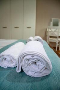Postel nebo postele na pokoji v ubytování Infinity Boutique Apartments