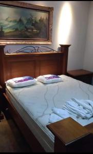 Un pat sau paturi într-o cameră la Sítio Cabanha Imperial