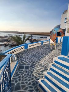 a set of stairs leading down to the water at Endo Mando in Shellal