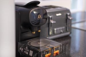 a black camera sitting on top of a counter at Constancevilla B9 - Grampian Lettings Ltd in Aberdeen