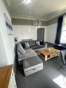 a living room with a couch and a coffee table at Castle Mount in Lincoln